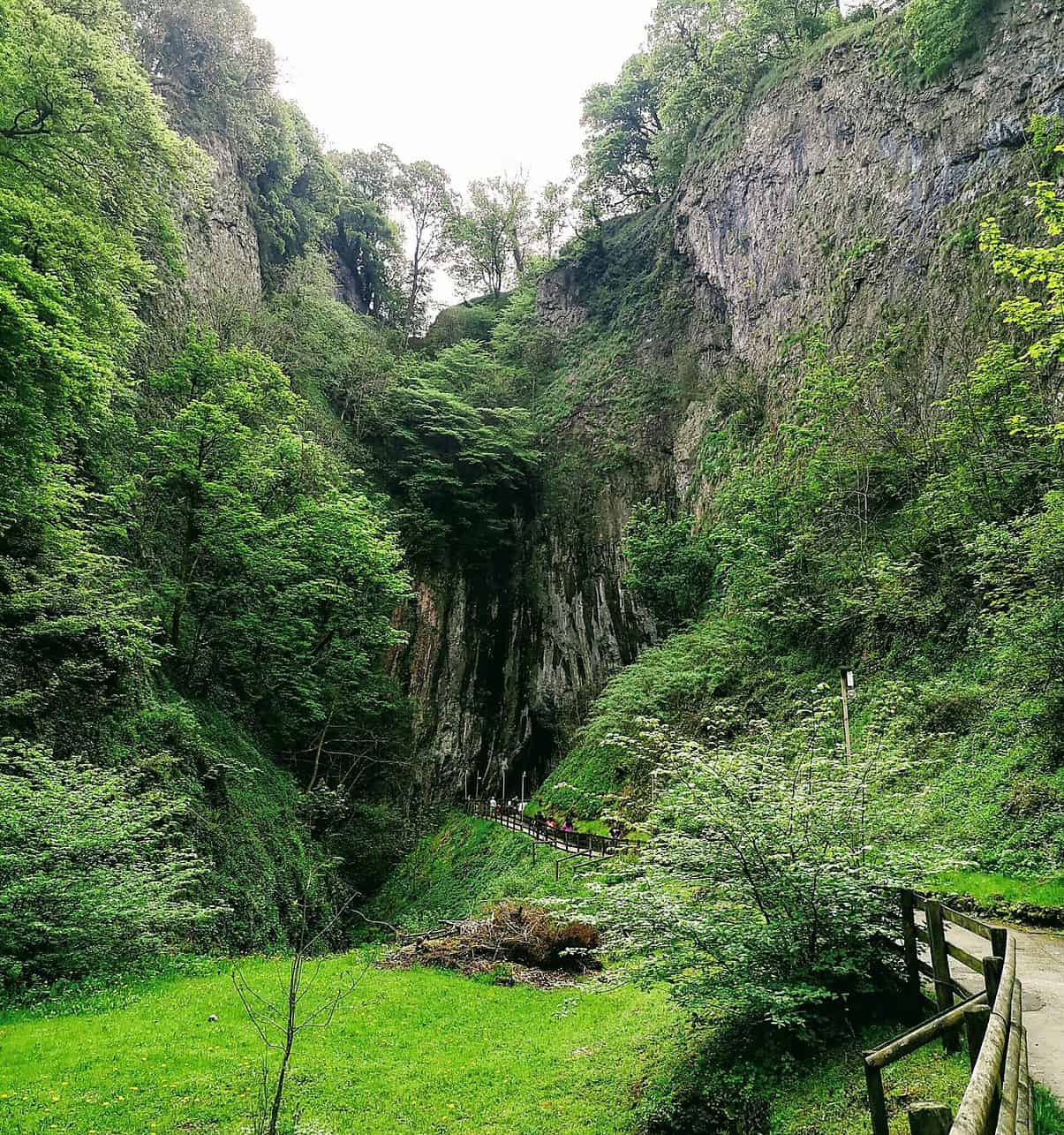 The entrance of Peak Cavern in Castleton is the largest cave entrance in the UK