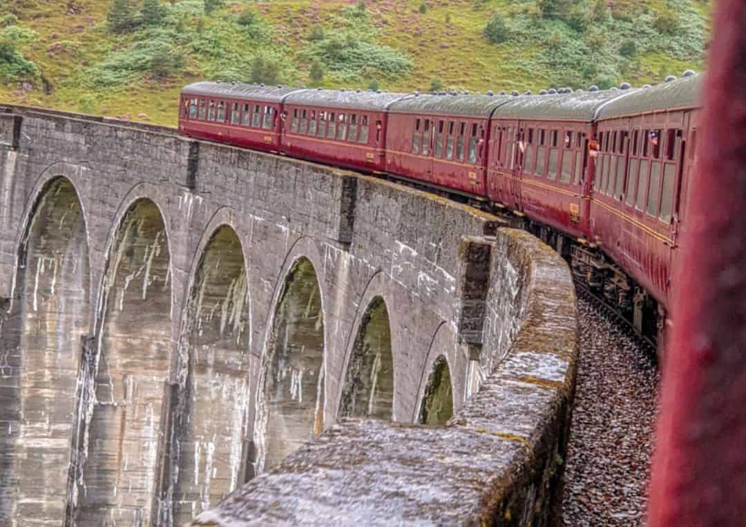 The Jacobite steam train going over Glenfinnan Viaduct